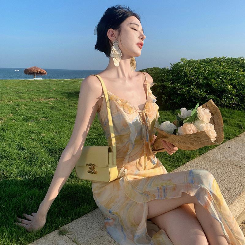 2025 Golden yellow robe seaside vacation style temperament dress Muse Fan Chaoxian fungus edge suspender floral beach dress