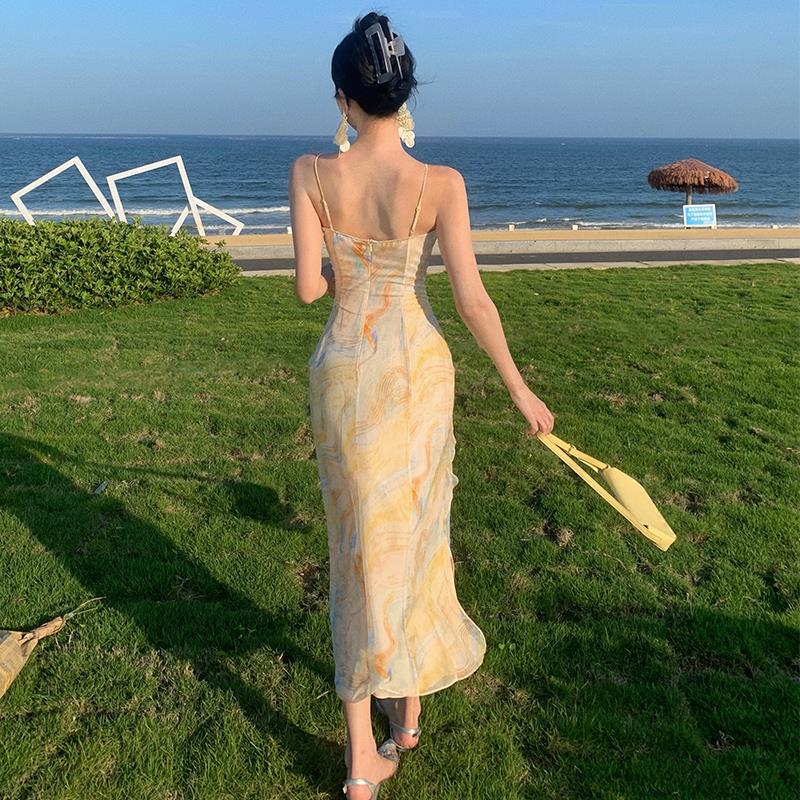 2025 Golden yellow robe seaside vacation style temperament dress Muse Fan Chaoxian fungus edge suspender floral beach dress